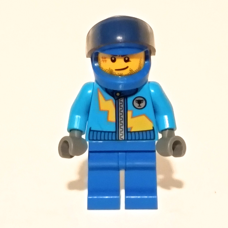 Coureur avec veste azur foncé avec fermeture à glissière et éclair jaune, casque bleu avec visière brun transparent (Racer with Dark Azure Jacket with Zipper and Yellow Lightning Bolt, Blue Helmet with Trans-Brown Visor)