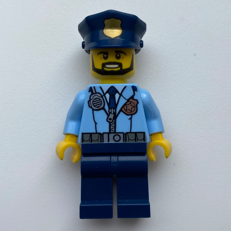 Policier, veste bleu clair vif avec fermeture éclair, radio, badge et cravate, jambes bleu foncé, chapeau de police bleu foncé avec badge, barbe (Policeman, Bright Light Blue Jacket with Zipper, Radio, Badge, and Tie, Dark Blue Legs, Dark Blue Police Hat with Badge, Beard)
