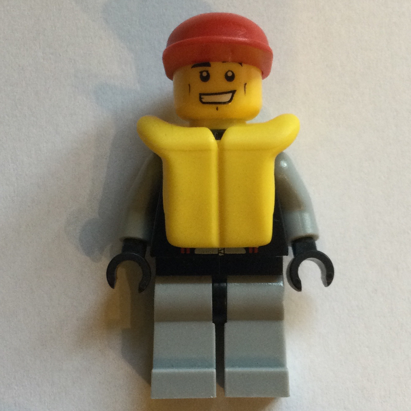 Sauveteur, combinaison noire et grise, casquette rouge, gilet de sauvetage jaune (Lifeguard, Black and Gray Wetsuit, Red Cap, Yellow Life Vest)