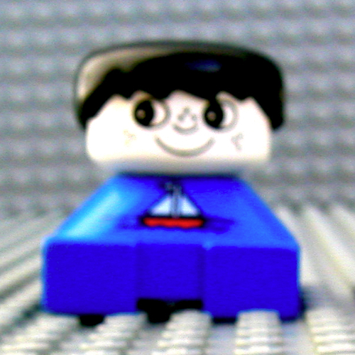 Visuel indicatif Rebrickable de Duplo 2 x 2 x 2 figurine brique, franges épineuses, têtes blanches, cheveux noirs, motif imprimé voilier (Duplo 2 x 2 x 2 Figure Brick, Spiky Bangs, White Heads, Black Hair, Sailboat Print)
