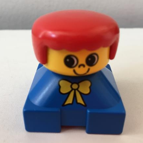 Visuel indicatif Rebrickable de Duplo 2 x 2 x 2 figurine brique, franges arrondies, cheveux roux, motif imprimé arc jaune (Duplo 2 x 2 x 2 Figure Brick, Rounded Bangs, Red Hair, Yellow Bow Print)