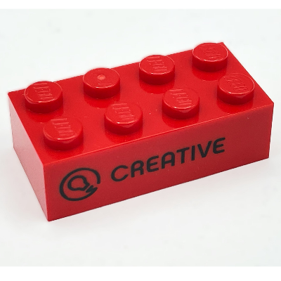 Visuel indicatif Rebrickable de Brique 2 x 4 avec motif imprimé 'CREATIVE' et icône / 'CREATIVA' (Brick 2 x 4 with 'CREATIVE' and Icon / 'CREATIVA' Print)