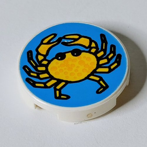 Visuel indicatif Rebrickable de Tuile ronde 2 x 2 avec fond bleu et motif imprimé crabe jaune (Tile Round 2 x 2 with Blue Background and Yellow Crab Print)