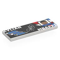 Visuel indicatif Rebrickable de Tuile 2 x 6 avec fond noir, formes bleues/rouges, 'KYLIAN MBAPPÉ', Motif imprimé portrait (Tile 2 x 6 with Black Background, Blue/Red Shapes, 'KYLIAN MBAPPÉ', Portrait Print)