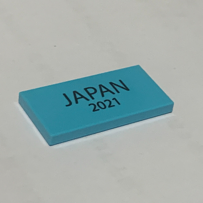 Visuel indicatif Rebrickable de Tuile 2 x 4 avec motif imprimé 'JAPAN 2021' (Tile 2 x 4 with 'JAPAN 2021' Print)